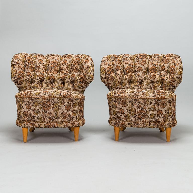 A pair of 1950's armchairs.