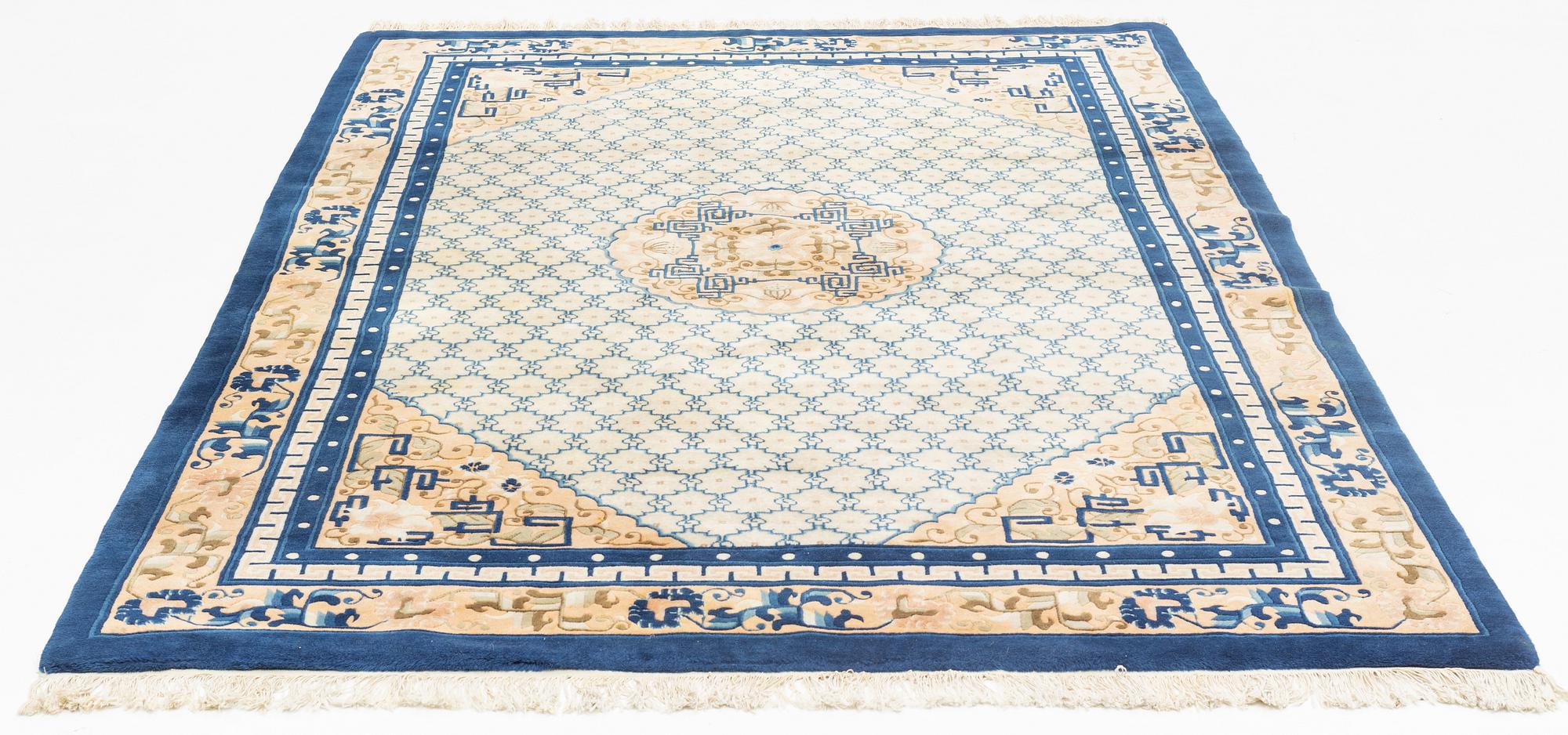 A carpet, China, antique finish, ca 275 x 185 cm.