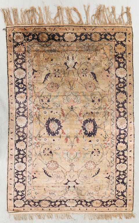 A semiantique Turkish silk carpet ca 183x122 cm.