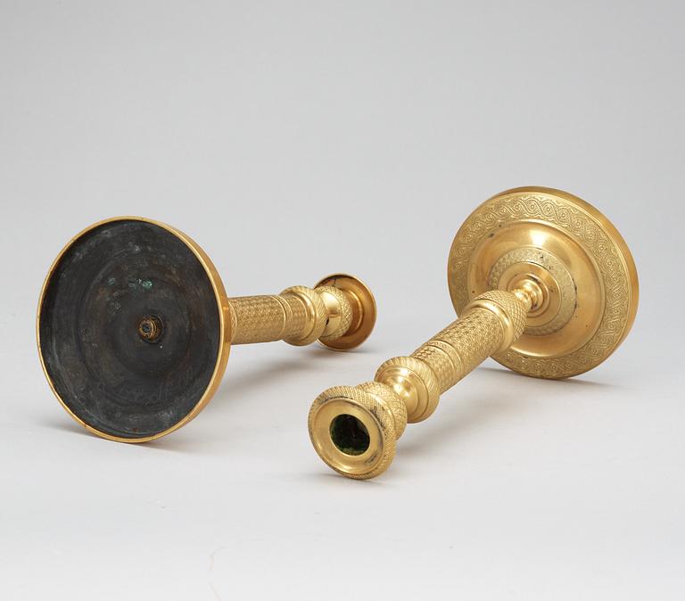 A pair of French Empire early 19th Century candlesticks.