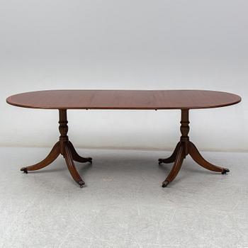 A late 20th century English dining table. One leaf included.