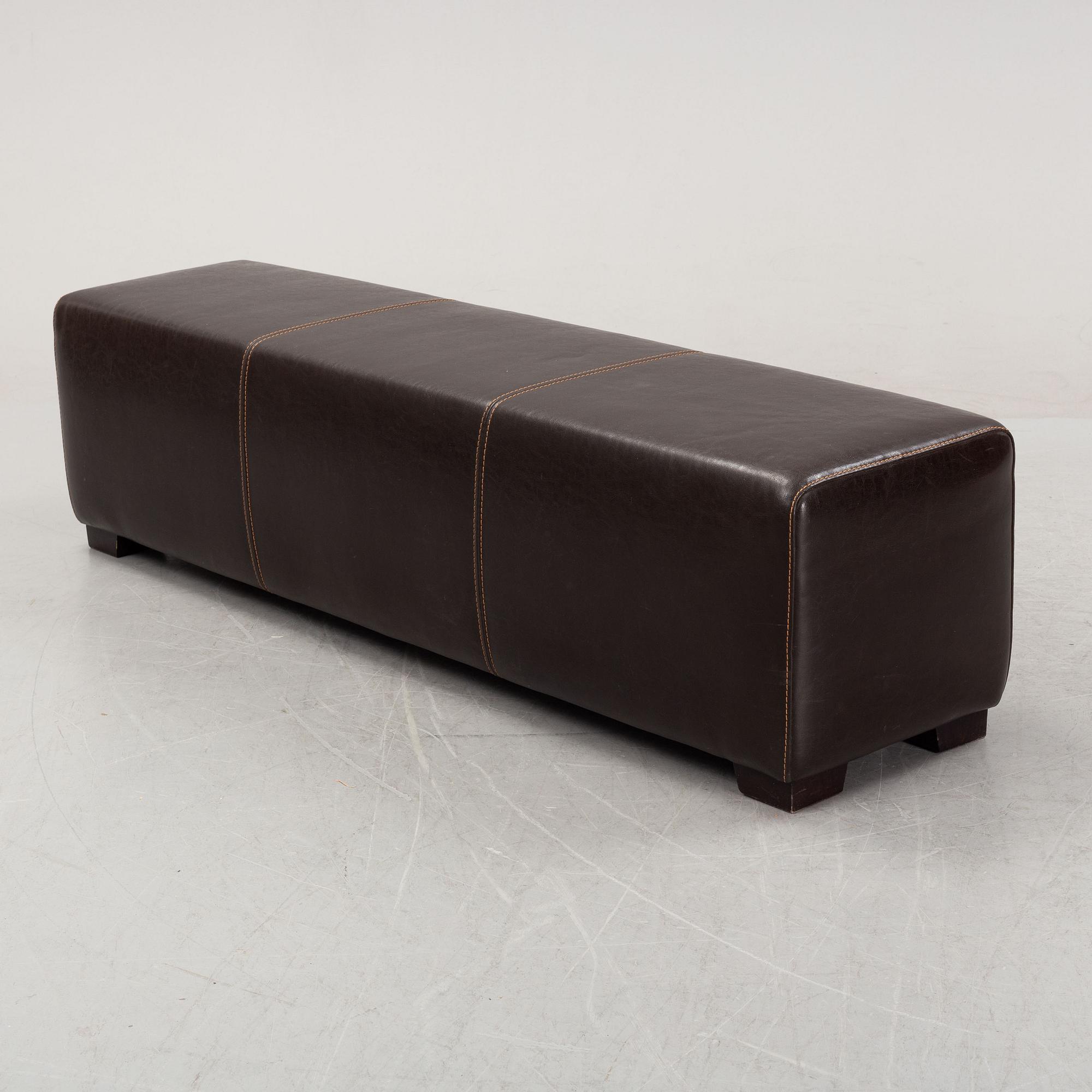 A leather-upholstered bench from Industria Divani e Poltrone, Italy.