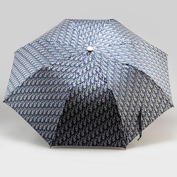 CHRISTIAN DIOR, a set of a clutch, a belt and an umbrella.