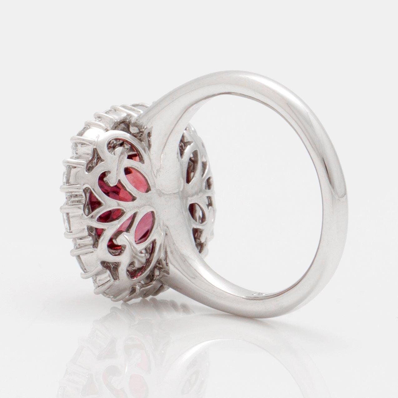 A 5.12 ct unheated red-orange sapphire and brilliant cut diamond ring. Total carat weight of diamonds circa 1.48 cts.