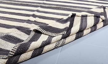 A FLATWEAVE RUG, 292 x 246 cm.