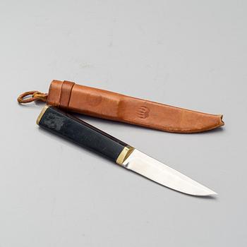 TAPIO WIRKKALA, PUUKKO-KNIFE, stainless steel, nylon and brass, Hackman Finland. Model designed in 1961.