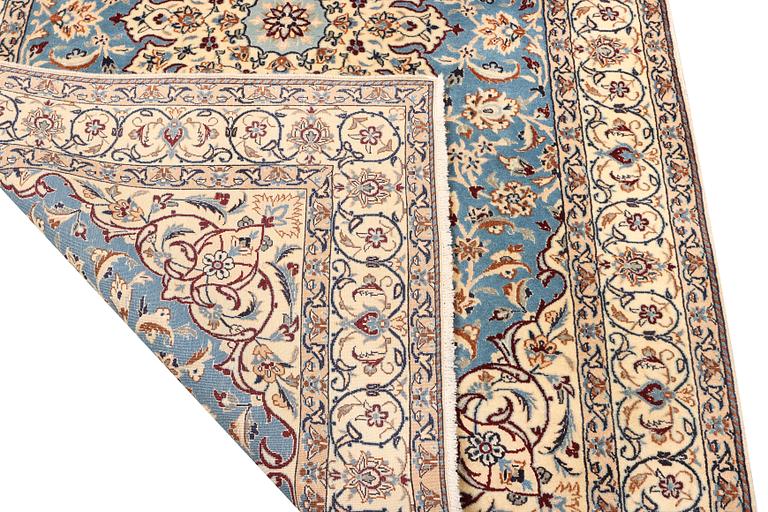 A Nain, part silk carpet, c. 196 x 120 cm.