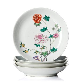 1047. A set of four famille rose floral dishes, Qing dynasty with a apocryphal six character mark.