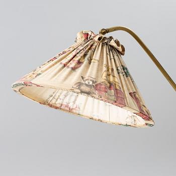 A 1940s Swedish Modern floor lamp.