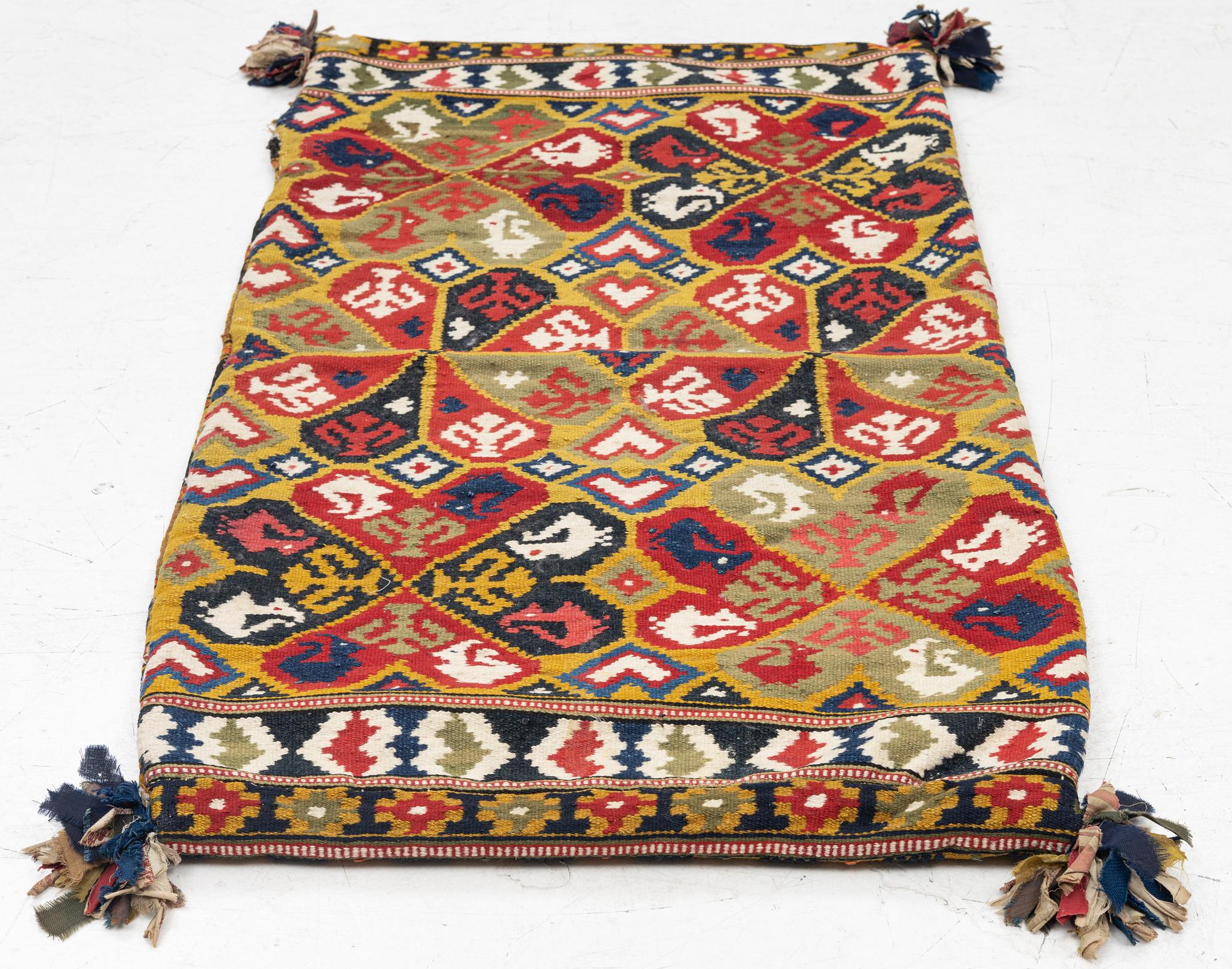 A double-interlocked tapestry carrige cushion, Österlen, Est Scania c. 102 x 53 cm.
