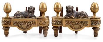 A pair of French late 18th century fire dogs.