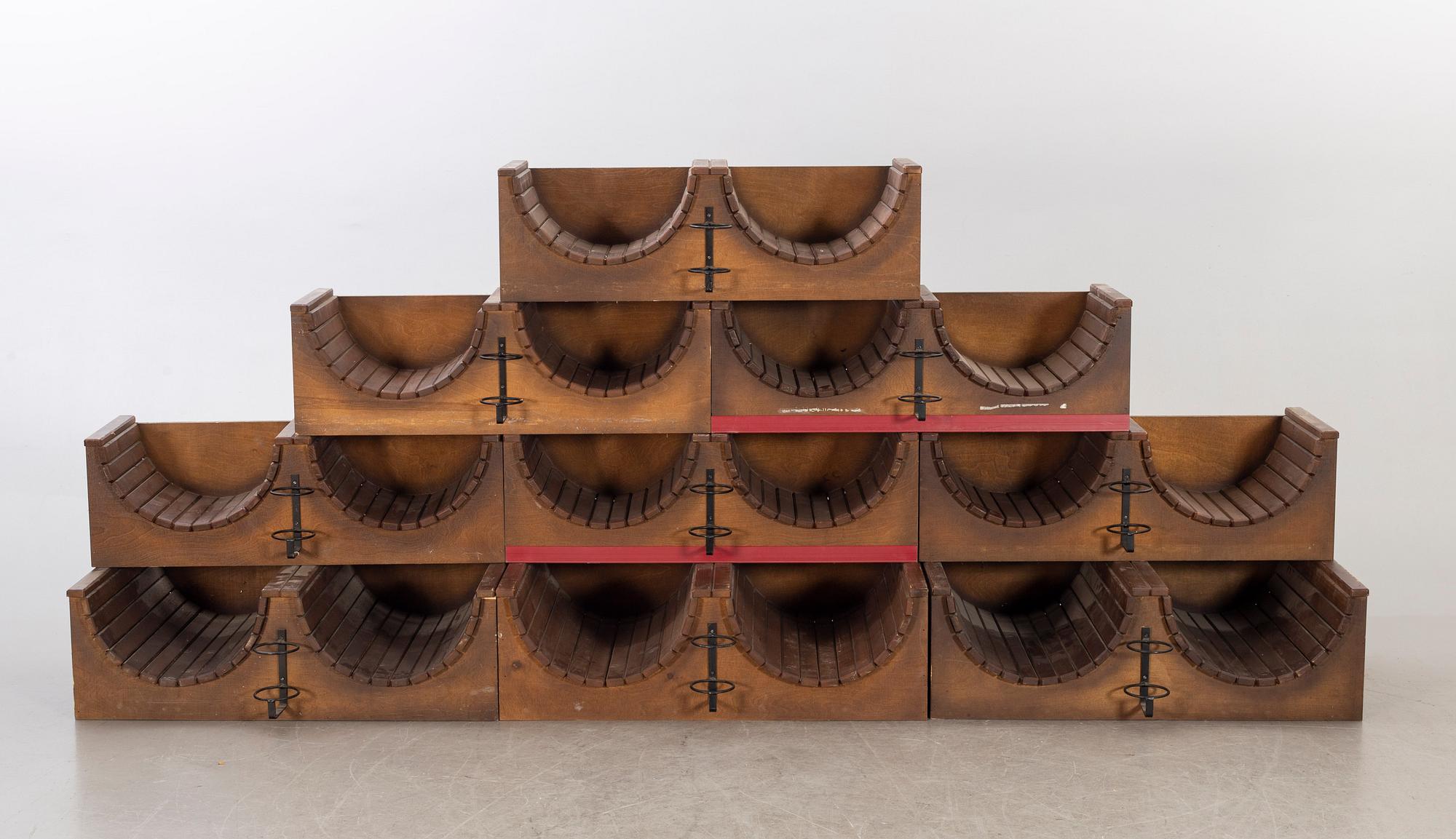 A set of nine loose wood wine racks from the turn of the century 1900/2000.