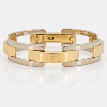 1041. An 18K gold and white gold Cartier bracelet.