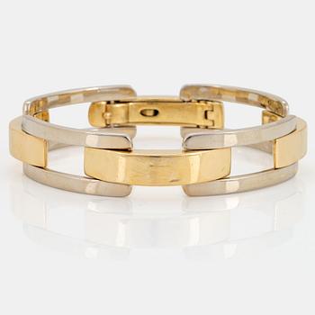 1041. An 18K gold and white gold Cartier bracelet.