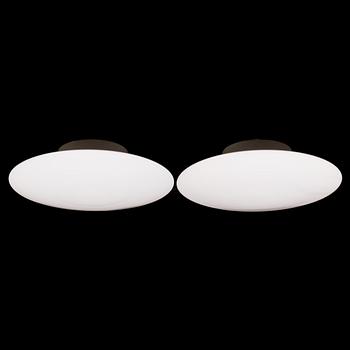 Arne Jacobsen, A pair of  'AJ-Eklipta' wall lights / ceiling lights, model 32012, for Louis Poulsen. Designed in 1959.