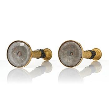 A pair of Napoleon III gilt and patinated bronze candlesticks, later part 19th century.