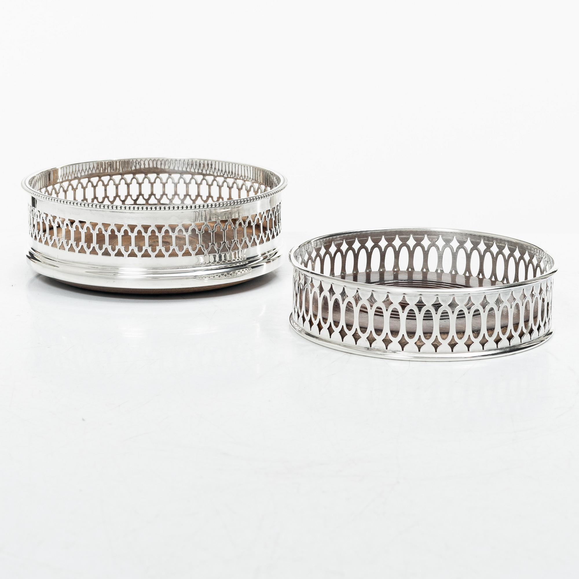 Two English silver coasters, mark of E Edmonds, Birmingham, 1930 and C J Vander Ltd, London 1969.