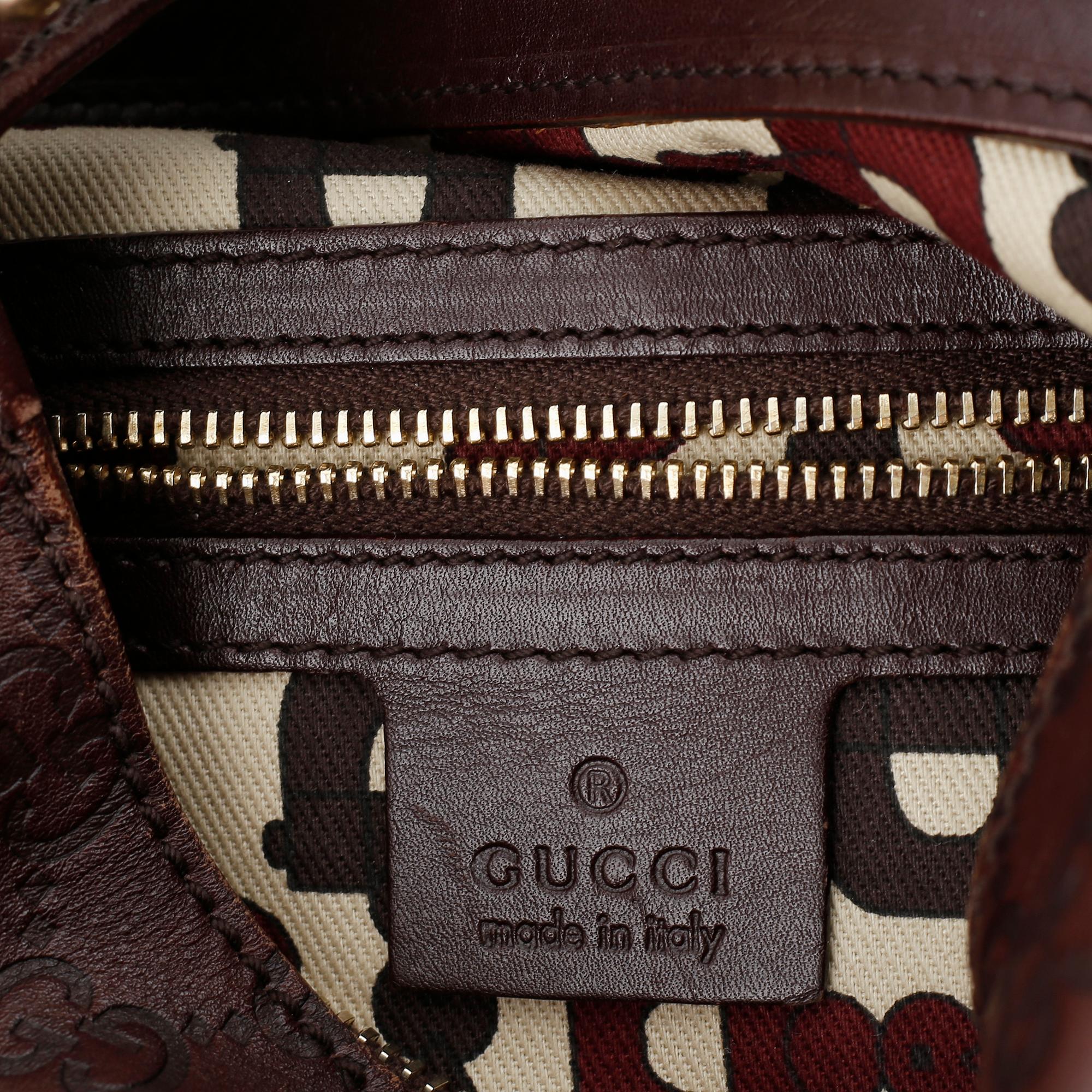 Gucci, a leather bag.