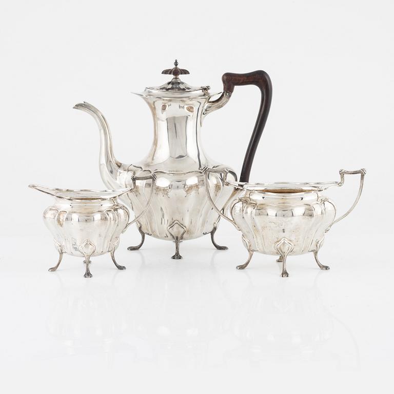 An English Silver Coffee Pot, Creamer and Sugar Bowl, mark of Walker & Hall, Sheffield 1914-18.