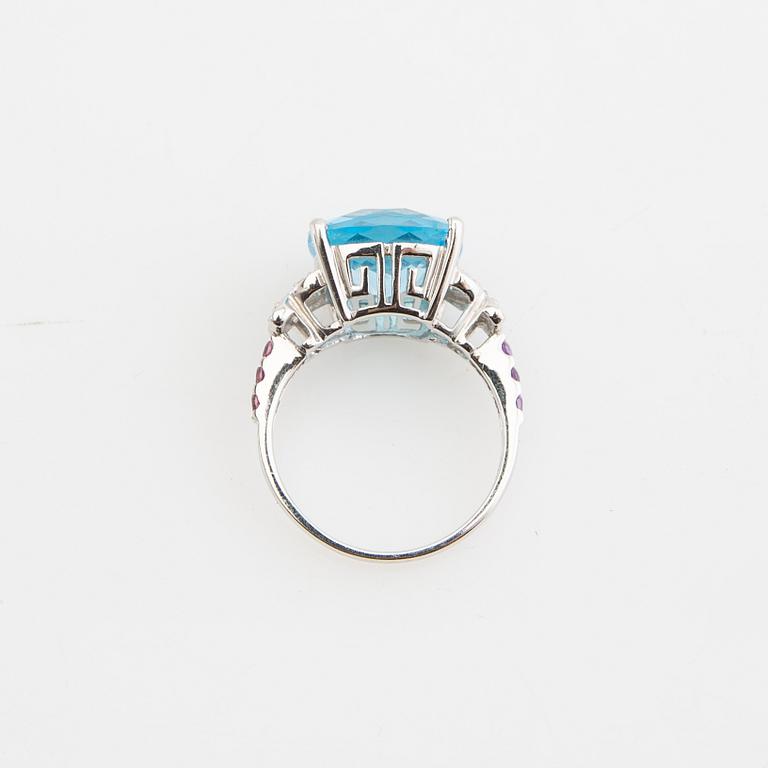 Ring, 14K gold with topaz, diamonds, and purple garnets.