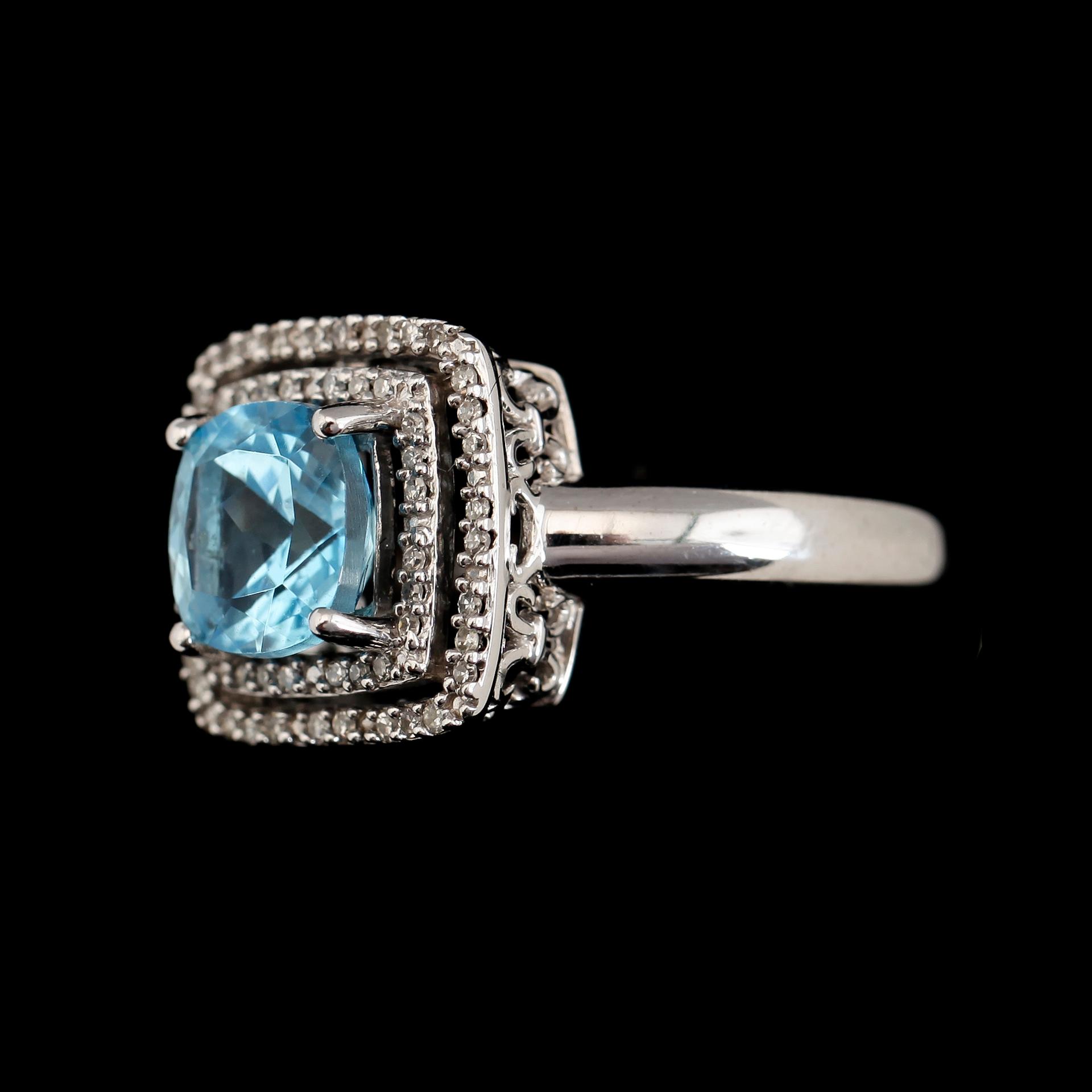 RING, 14K vitguld, diamanter tot ca 0.17 ct och topas. Total vikt ca 5 g.