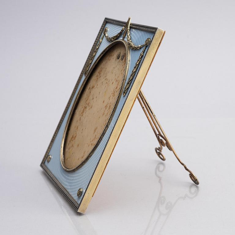 A Fabergé parcel-gilt silver and enamel frame, workmaster Antti Nevalainen, St Petersburg 1899-1908.