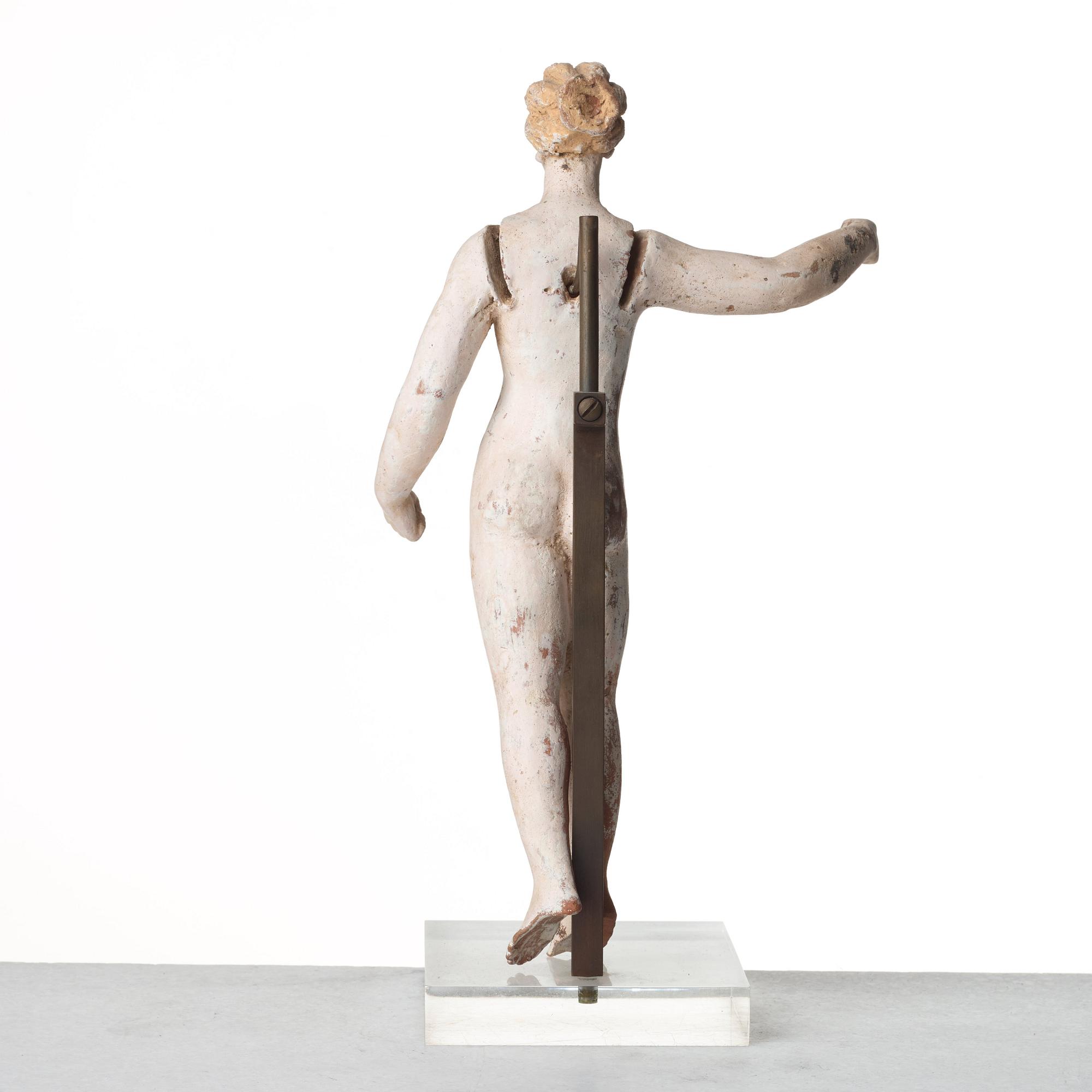 A Greek terracottta scultpure of Eros, Hellenistic period, Canosa, probably circa 3rd Century A.D.