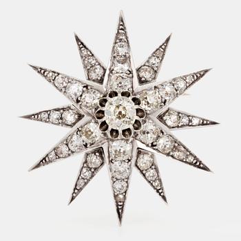 A star brooch set with old-cut diamonds.