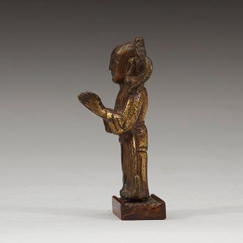 A gilt bronze figure of a standing boy, Ming dynasty, 15th/16th century.