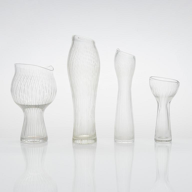 Tapio Wirkkala, four line-cut clear glass vases, signed Tapio Wirkkala Iittala.