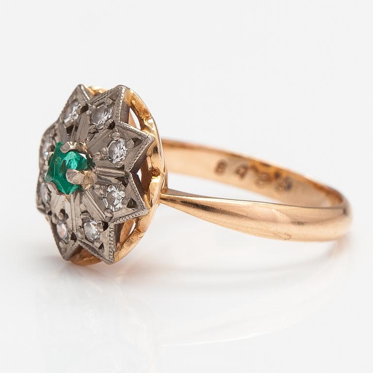 A 14K gold ring with diamonds ca. 0.40 ct in total and an emerald. Yerevan.