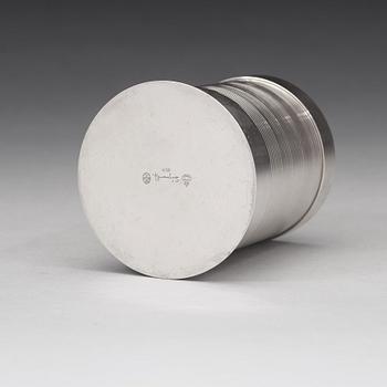 Sigvard Bernadotte, A Sigvard Bernadotte sterling bottle holder (for beer bottle), Georg Jensen, Copenhagen 1925-32.