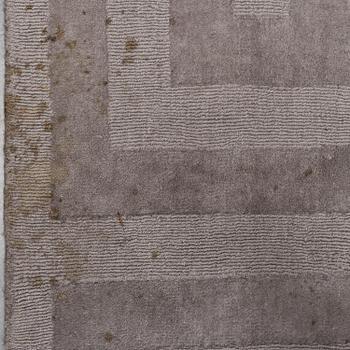 A Layered "Wool Cubes" carpet, 390x620 cm.