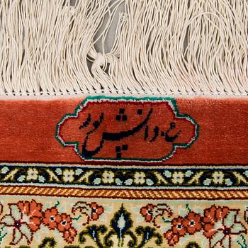 A signed Qum silk carpet, old, 310x199 cm.