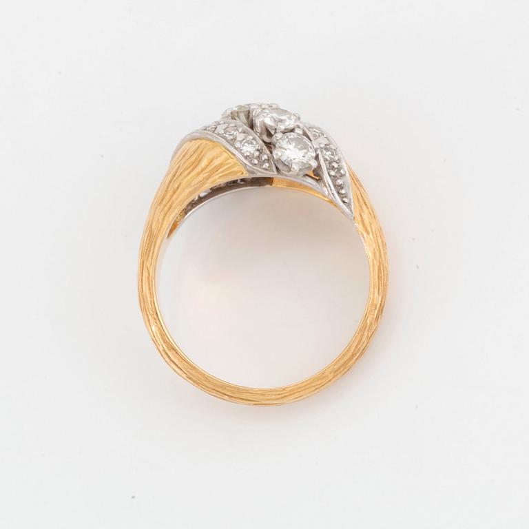 A WA Bolin ring in 18K gold set with round brilliant-cut diamonds.