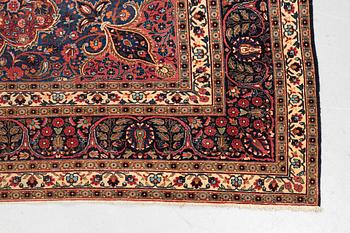 A carpet, semi-antique Mashad/Moud, ca 292 x 214 -218 cm.