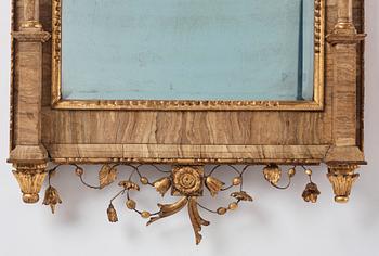 A pair of North-Italian Louis-XVI marble-mounted and carved giltwood mirrors, circa 1800.