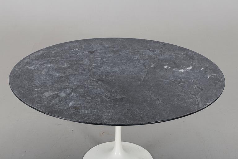 AN EERO SAARINEN "TULIP" TABLE BY KNOLL INTERNATIONAL.