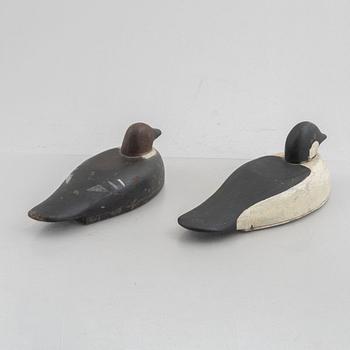 A pair of painted wooden duck decoys.