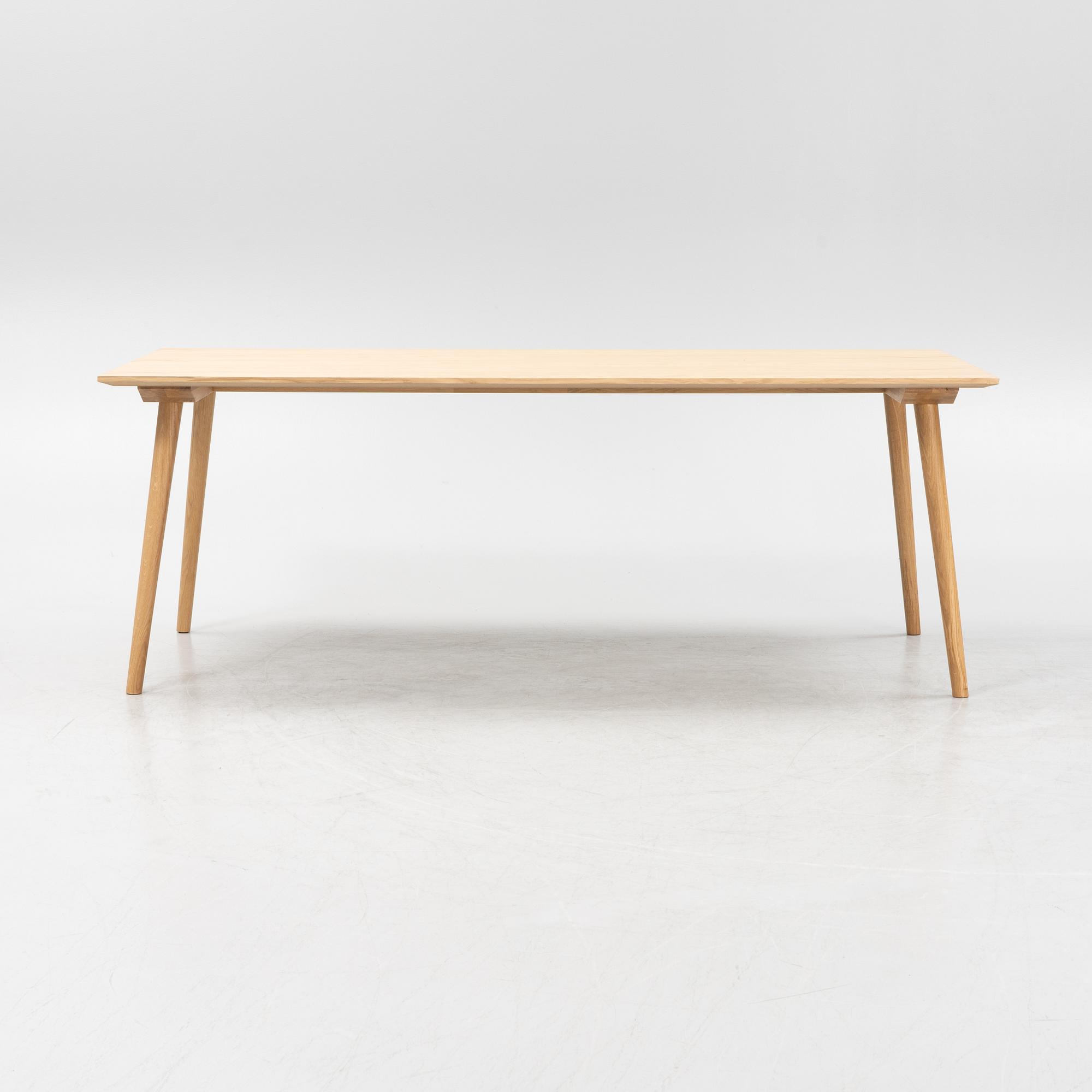 Sami Kallio, an oak veneered 'In Between' dining table from &tradition.