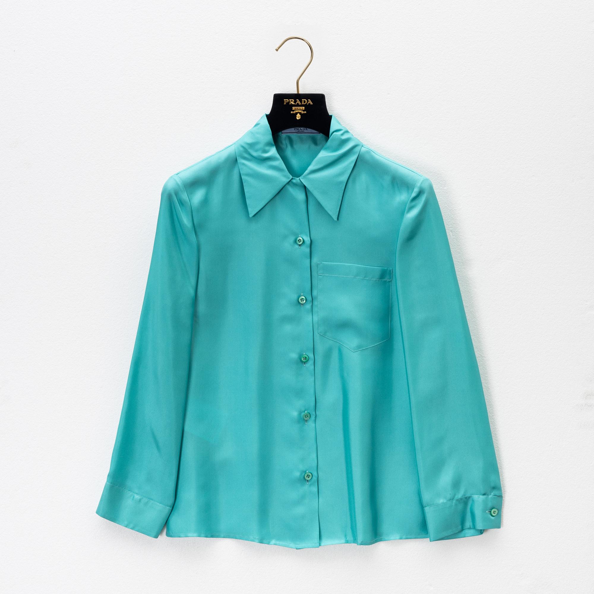 Prada, a turquoise silk blouse, size 36.