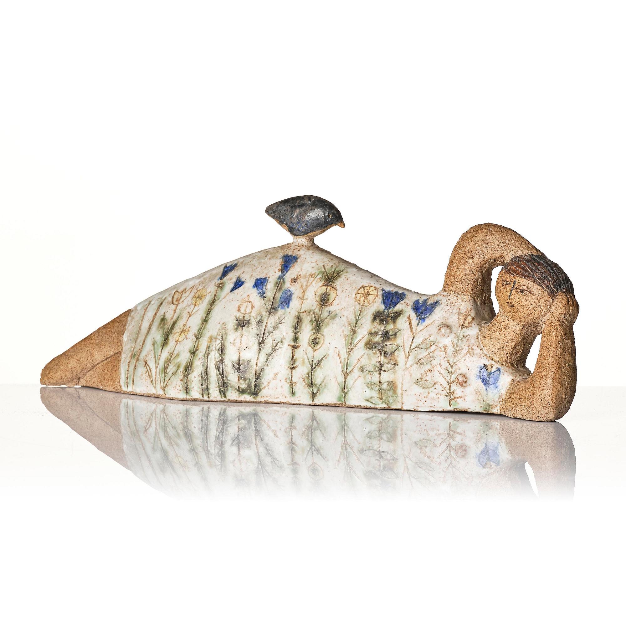 Lisa Larson, a unique chamotte stoneware sculpture of a reclining female figure with a bird, Gustavsberg Studio, probably 1950s-60s.