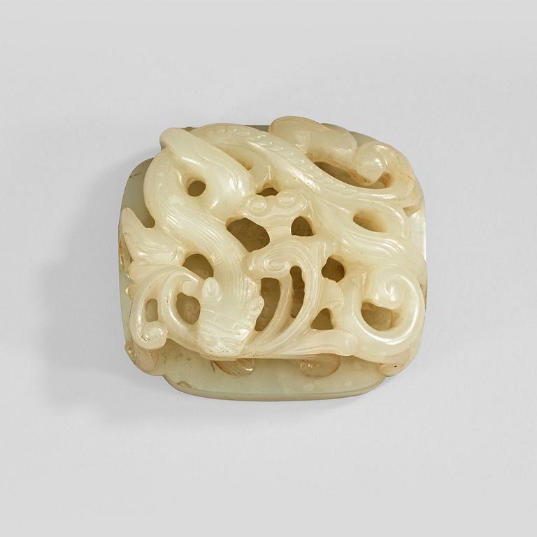 A carved white nephrite belt ornament, Qing dynasty (1644-1912).