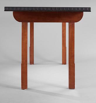 A Hjalmar Jackson ebony and pear wood desk / library table, Stockholm 1934, possibly designed by Oscar Nilsson.