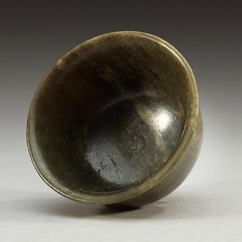 A green marble bowl, Qing dynasty (1644-1912), with Qianlong six character mark.