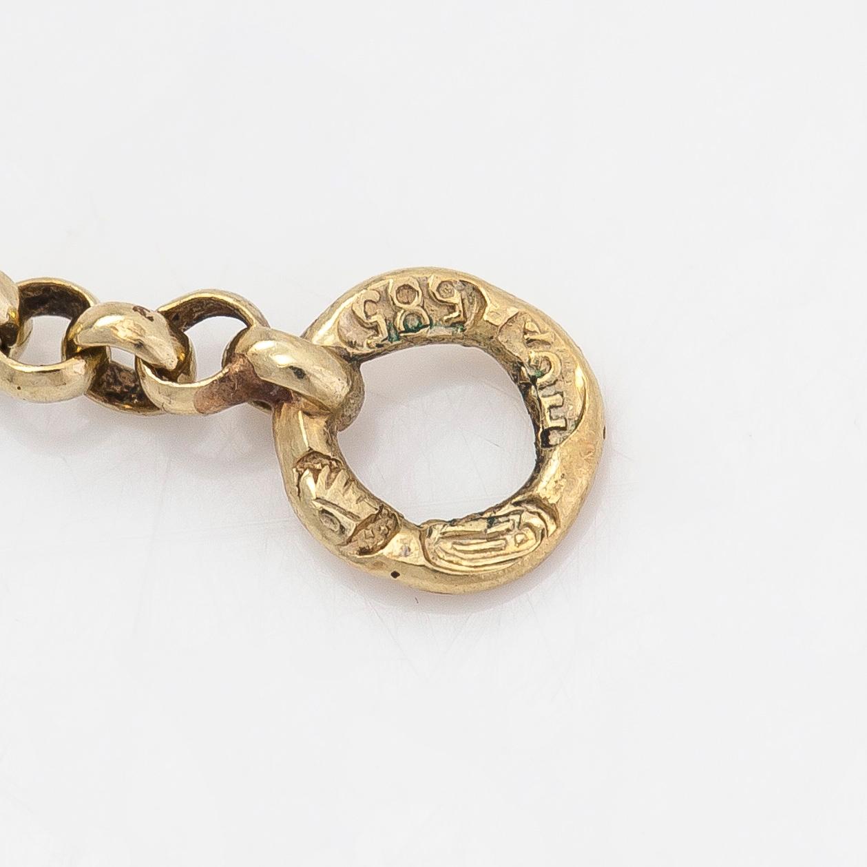 Lornjett med kedja, 14K guld. Importstämplad Hugo Grün, Helsingfors 1929.