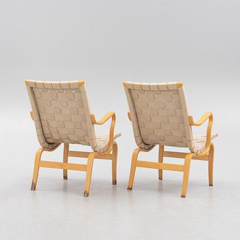 Bruno Mathsson, a pir of 'Eva' armchairs, Dux, late 20th century.