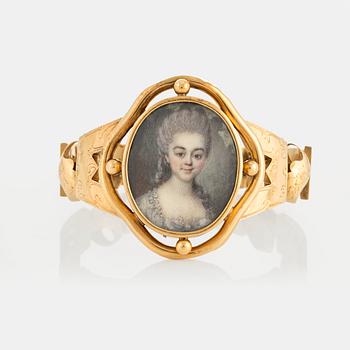 An 18K gold bracelet with an 18th century miniature portrait of Jeanne de Nesle, according to engraving.