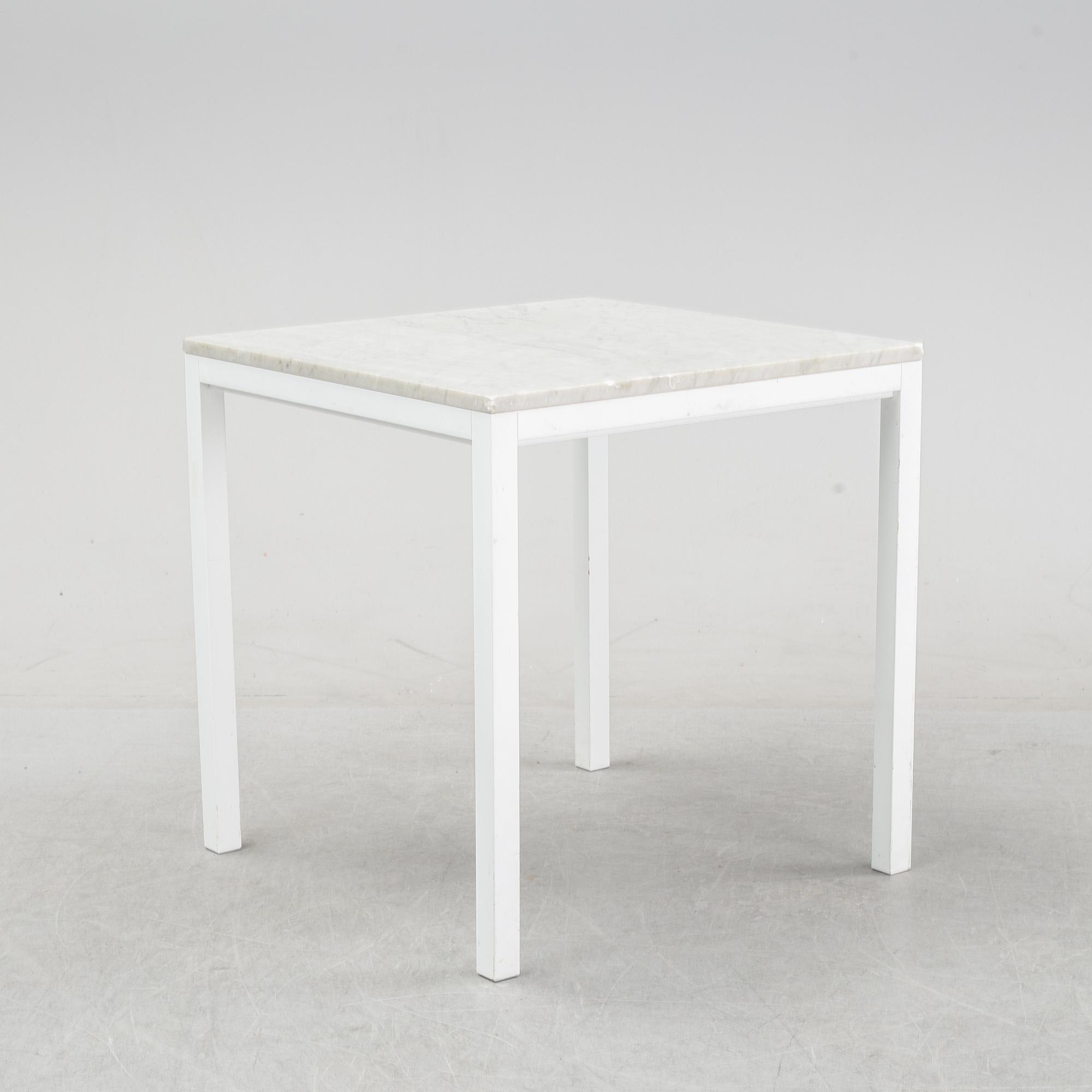 A marble top table, 21th century.