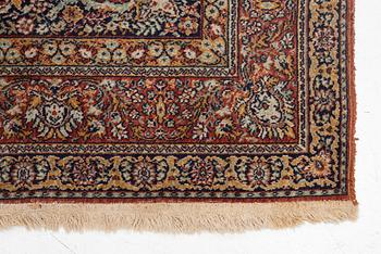 A semi-antique oriental carpet, c. 290 x 195 cm.